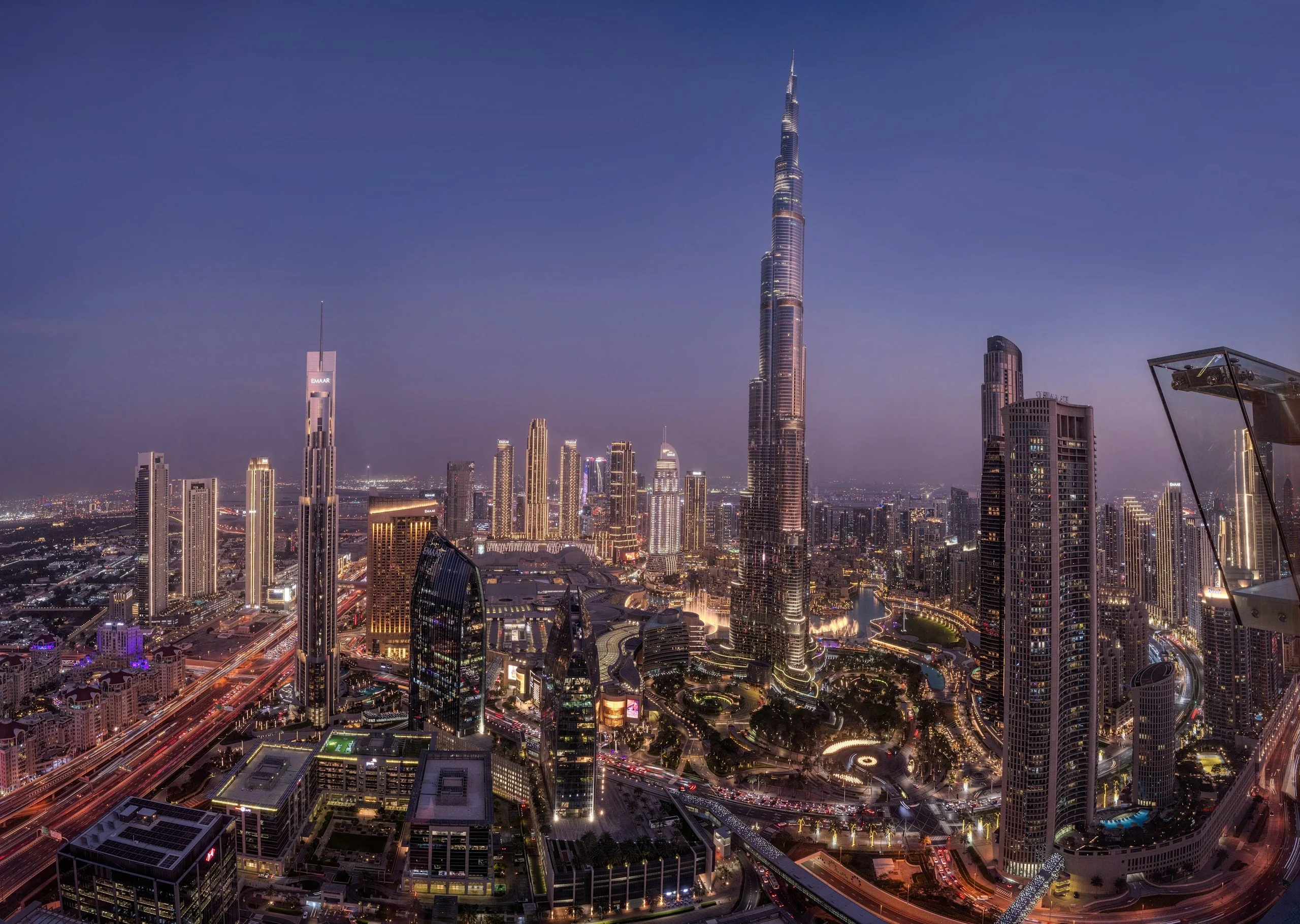 Burj Khalifa above Downtown Dubai and the Dubai Fountain at twilight