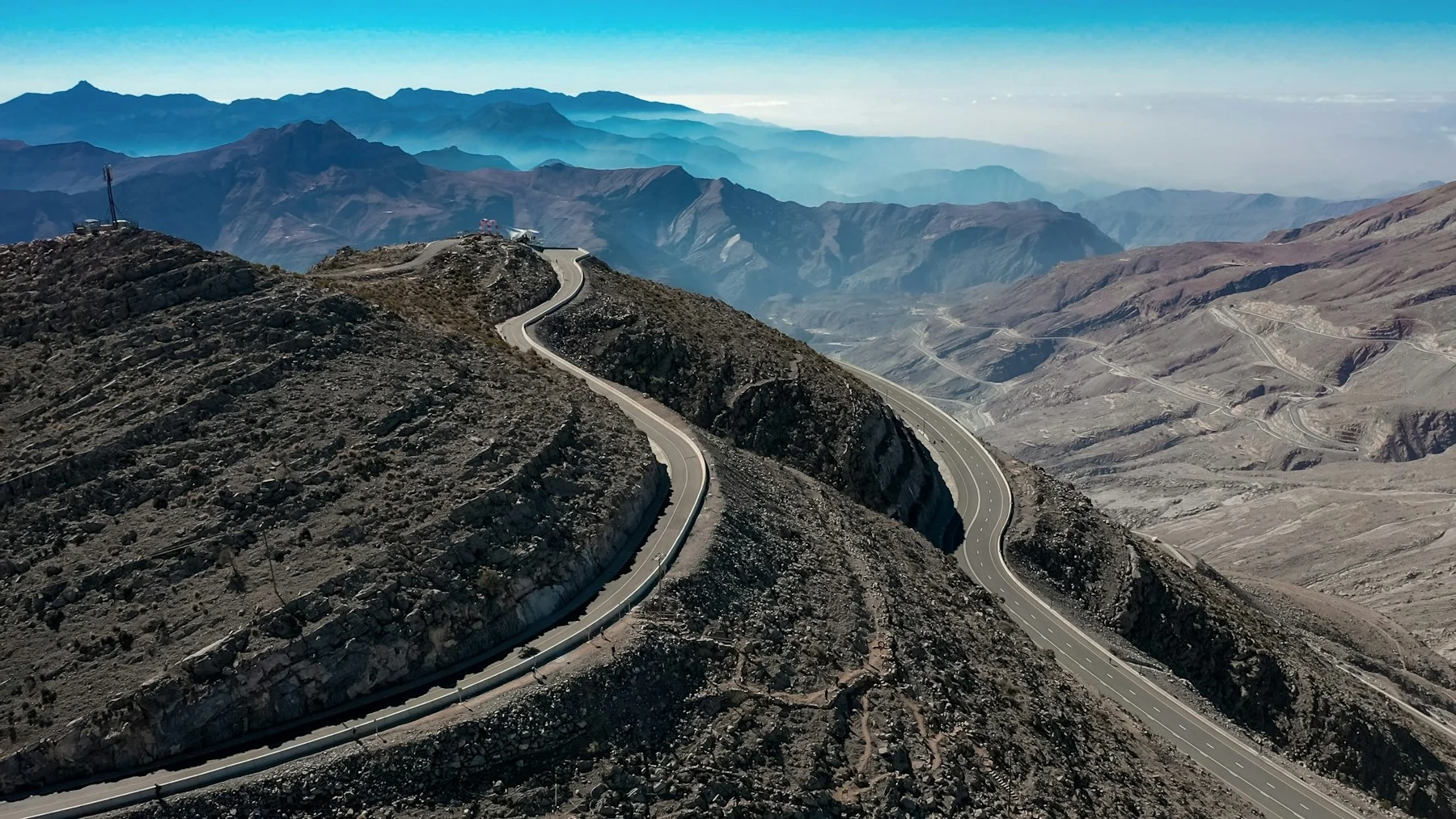 A winding road through the dramatic mountains of Jebel Jais