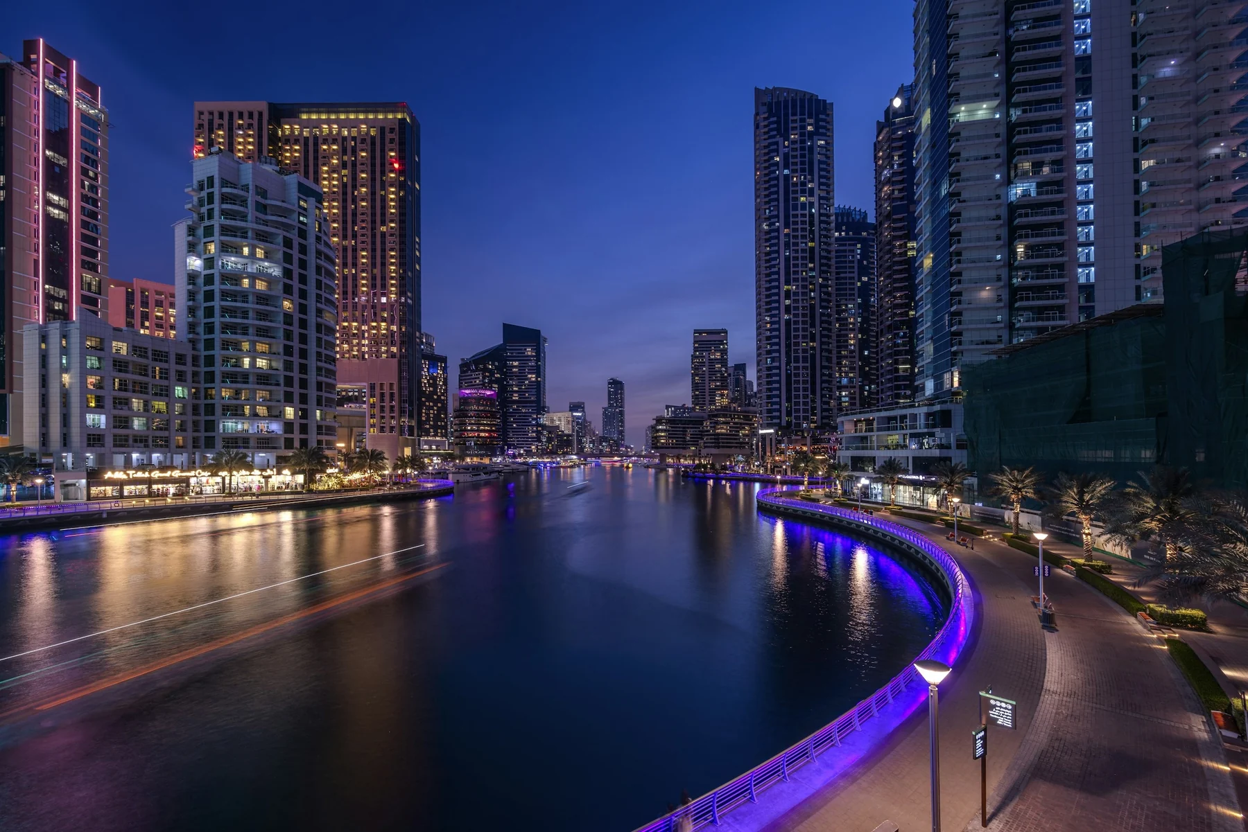 Dubai Marina’s towers and waterfront illuminated at blue hour